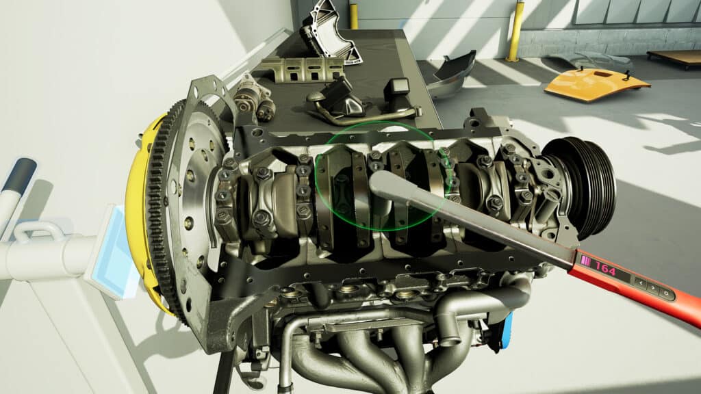 Perfección como simulador de mecánica automotriz: La imagen muestra una representación detallada en 3D de un motor de coche con varios componentes visibles, como el bloque del motor, los pistones y el cigüeñal. El entorno parece ser un taller o garaje con herramientas y equipo en el fondo. Esta imagen es relevante para fines educativos, intereses de ingeniería mecánica o para aquellos curiosos sobre el funcionamiento interno de un motor de automóvil.
