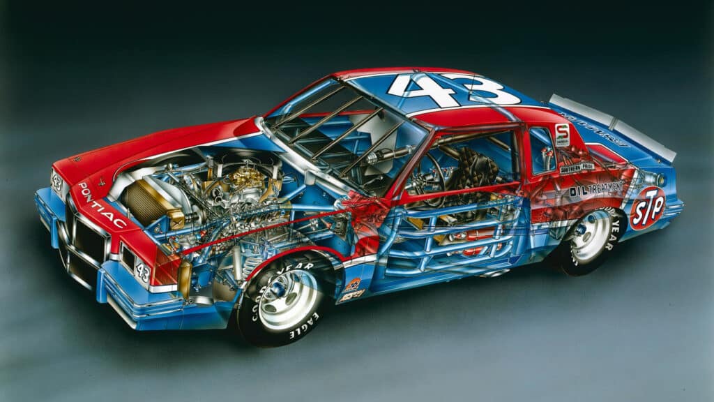 Imagen de un Pontiac de NASCAR número 43, perteneciente a Richard Petty. El vehículo está mostrado sin paneles exteriores, revelando el chasis detallado, el motor y los componentes internos. Predominan los colores azul y rojo con patrocinadores como STP y otros logotipos visibles en la carrocería. El coche está posicionado sobre un fondo gris neutro que resalta su diseño e ingeniería.