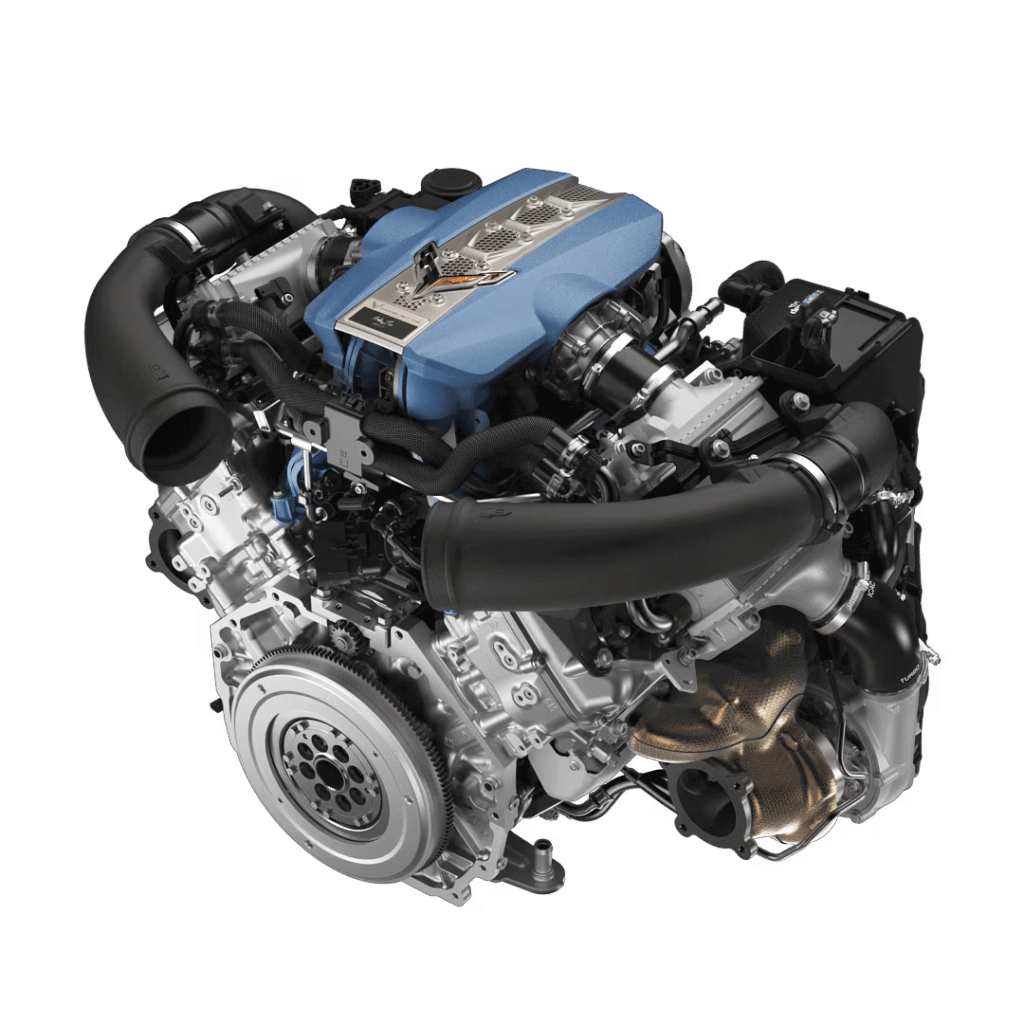 Imagen del motor del Corvette ZR1 2025, un motor V8 biturbo de 5.5 litros con cigüeñal plano. El motor tiene una cubierta superior azul con un emblema distintivo en el centro. Se pueden ver componentes como el bloque del motor, cabezales, colector de admisión y tuberías. El fondo es blanco, destacando el diseño detallado y la complejidad del motor.