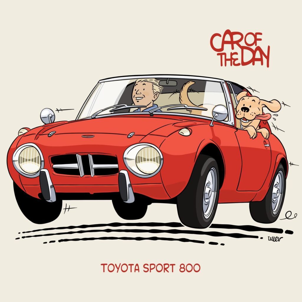 Ilustración con el título “CAR OF THE DAY”. La imagen muestra un Toyota Sport 800 rojo con un personaje de dibujos animados que se asemeja a un perro, sentado en el asiento del pasajero, sacando la cabeza y la lengua por la ventana.