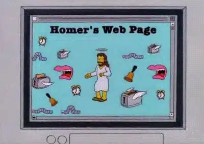 Una pantalla de computadora muestra una página web titulada “Homer’s Web Page”. La página presenta una figura central que se asemeja a Homer Simpson con alas de ángel y un halo, rodeado de varios elementos animados y parpadeantes como papeles, sobres de correo, una taza de café y un borde en llamas animado en la parte inferior. La imagen hace referencia al episodio de “Los Simpson” donde Homer Simpson crea su propio sitio web. La imagen sugiere el uso de “Redacción SEO para sitios web de automóviles” en el contexto de páginas web personales y decoradas excesivamente.