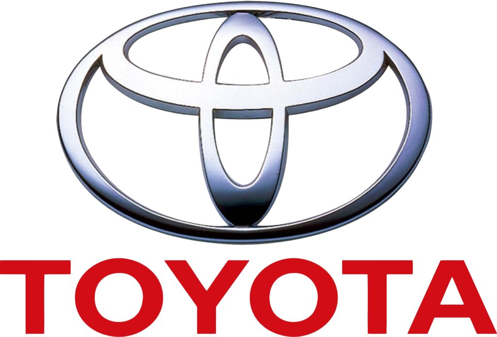 Logotipo de Toyota: Un óvalo estilizado que representa la letra “T” dentro de un óvalo más grande. Debajo del logotipo, la palabra “TOYOTA” está escrita en mayúsculas.