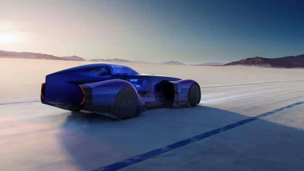 El Renault Filante 2025 es un coche futurista y elegante de color azul, visto en una superficie plana y expansiva con un amanecer o atardecer de fondo. El coche tiene un diseño aerodinámico con grandes ruedas cubiertas y parece estar moviéndose a alta velocidad, como sugiere el desenfoque de movimiento. El entorno es probablemente una salina o un área abierta similar, que a menudo se utiliza para pruebas de alta velocidad. El coche tiene el texto 'Renault' y '100' visible en su lateral, indicando que podría ser un modelo especial o un concepto de Renault, posiblemente llamado 'Filante' para el año 2025. Esta imagen es interesante y relevante ya que muestra un diseño automotriz avanzado y tecnología, insinuando futuras innovaciones en la industria automotriz.